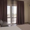Отель Happy Inn. Делюкс трехместный с террасой и панорамным  видом на море 1