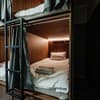 Отель Nesvit Capsule Hotel. Место в мужском 8-местном номере  2